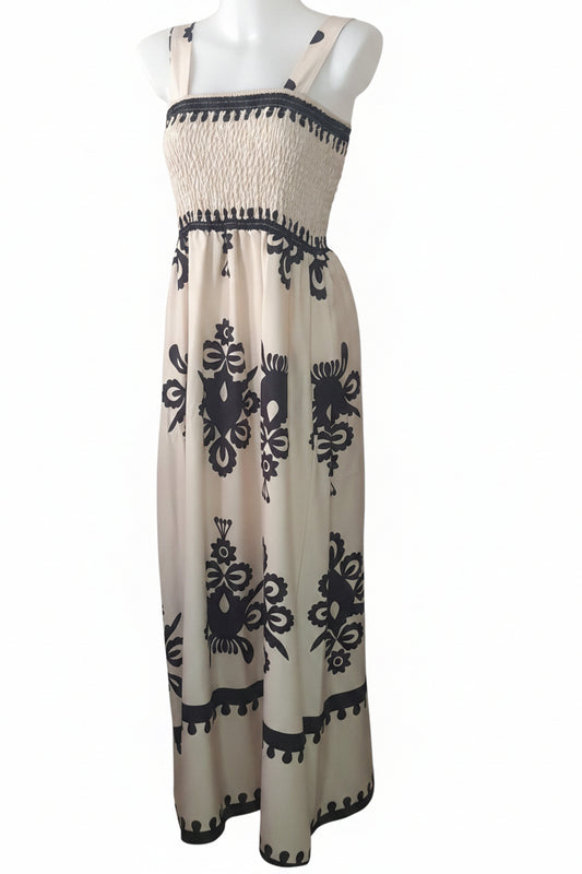 Robe beige avec motif noir.