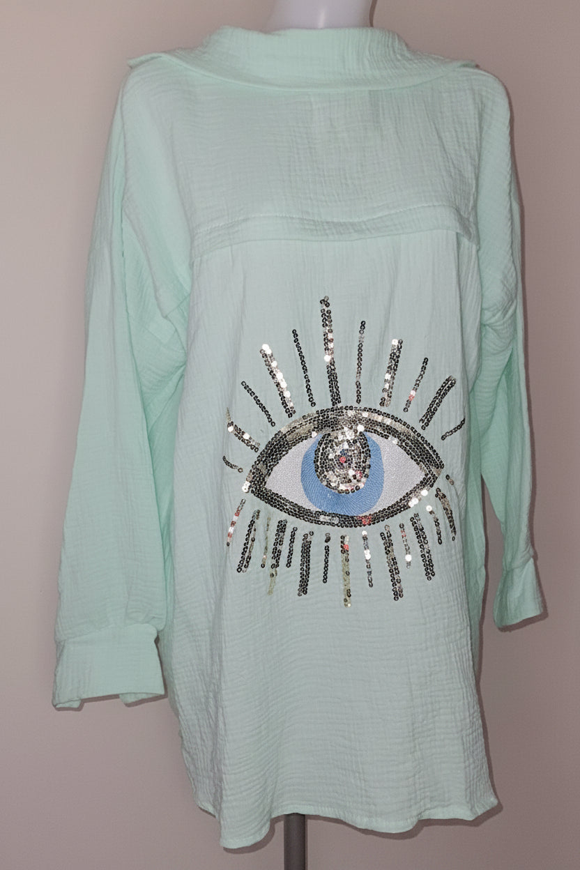 Chemise oversize texturée avec motif œil brodé.