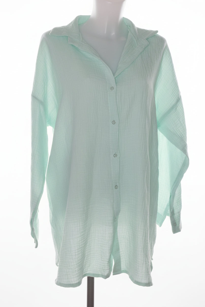 Chemise oversize texturée avec motif œil brodé.